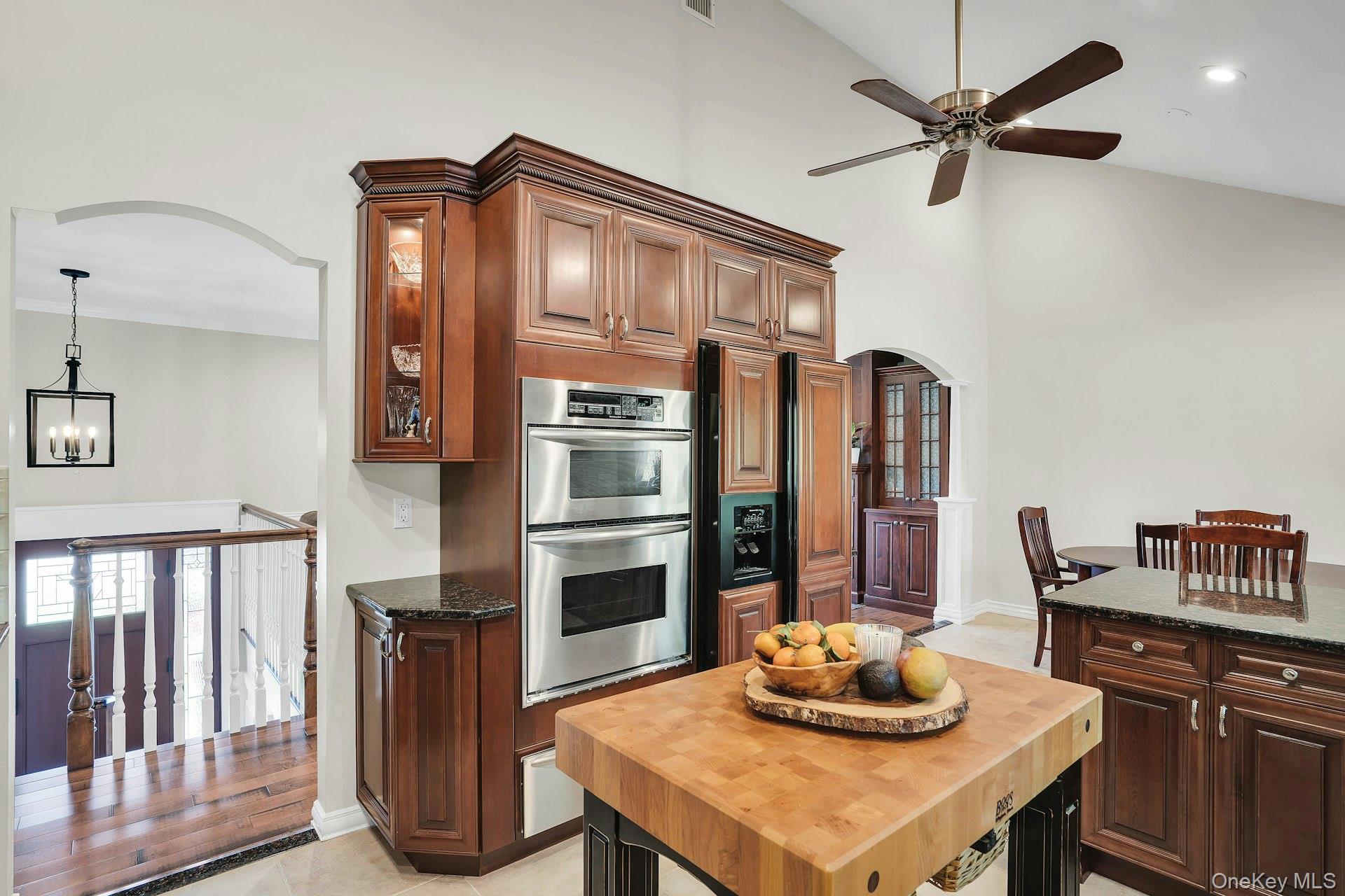 101 Hayrick Lane Commack, NY 11725 - Photo 17 of 50 a kitchen with stainless steel appliances a dining table and stove
