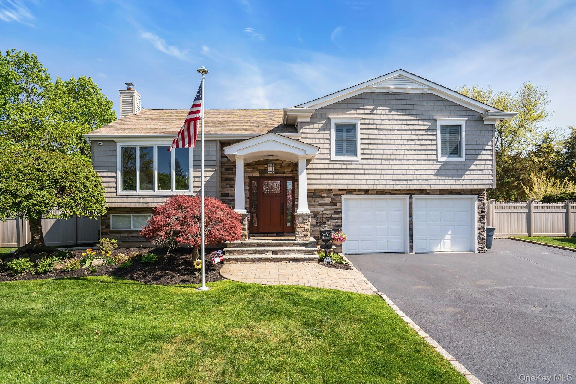 101 Hayrick Lane Commack, NY 11725 - Photo 2 of 50 a front view of a house with a yard
