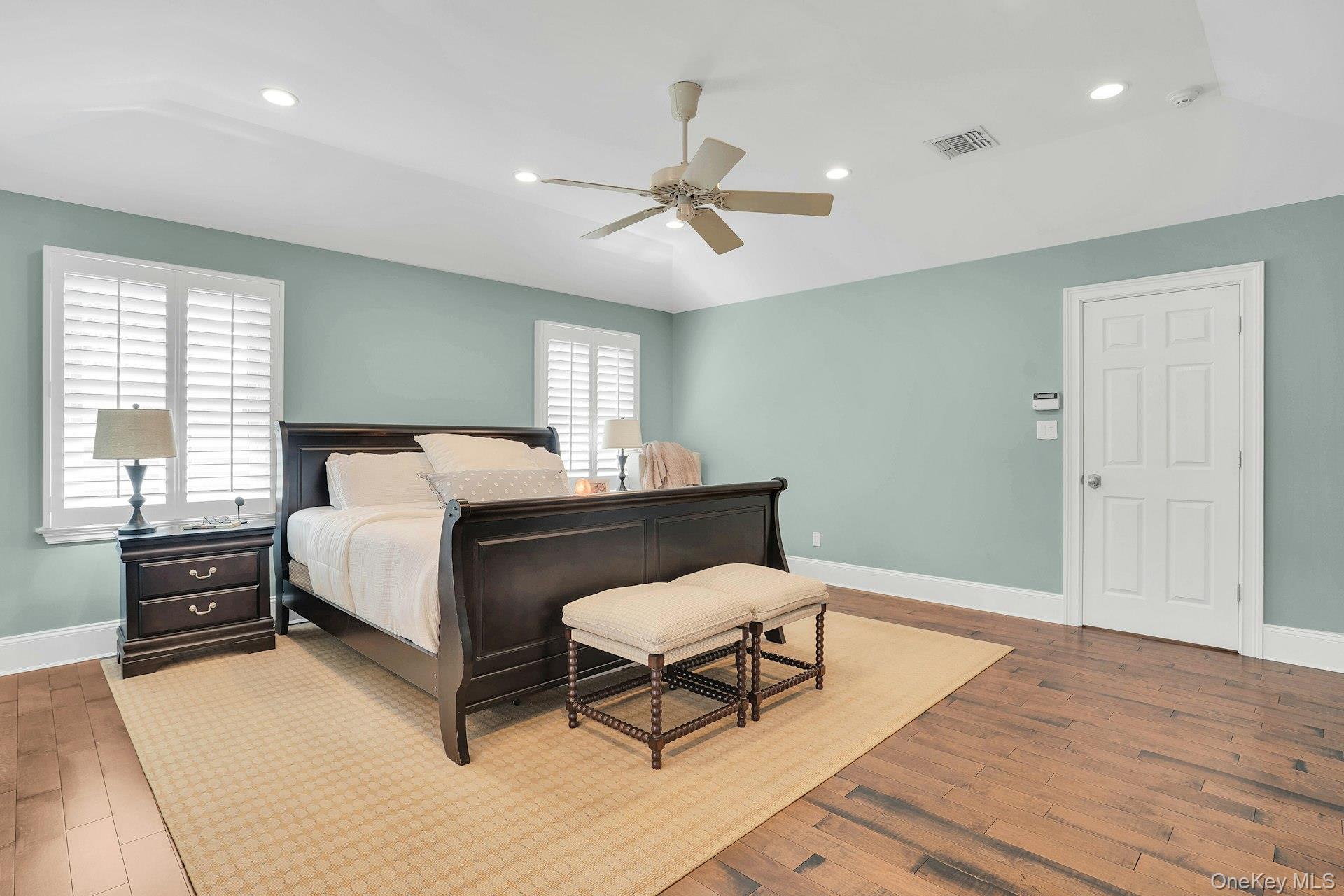 101 Hayrick Lane Commack, NY 11725 - Photo 21 of 50 a bedroom with a bed and wooden floor