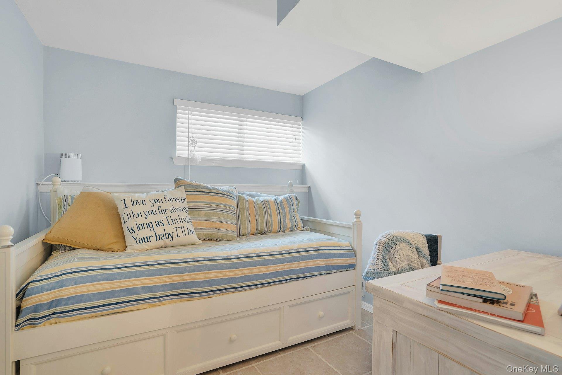 101 Hayrick Lane Commack, NY 11725 - Photo 28 of 50 a spacious bedroom with a bed and next to a window
