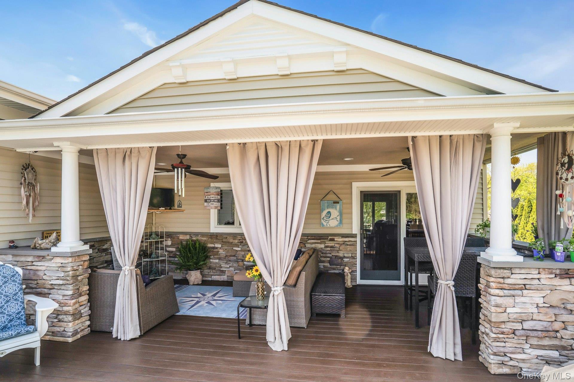 101 Hayrick Lane Commack, NY 11725 - Photo 37 of 50 a front view of a house with outdoor seating space