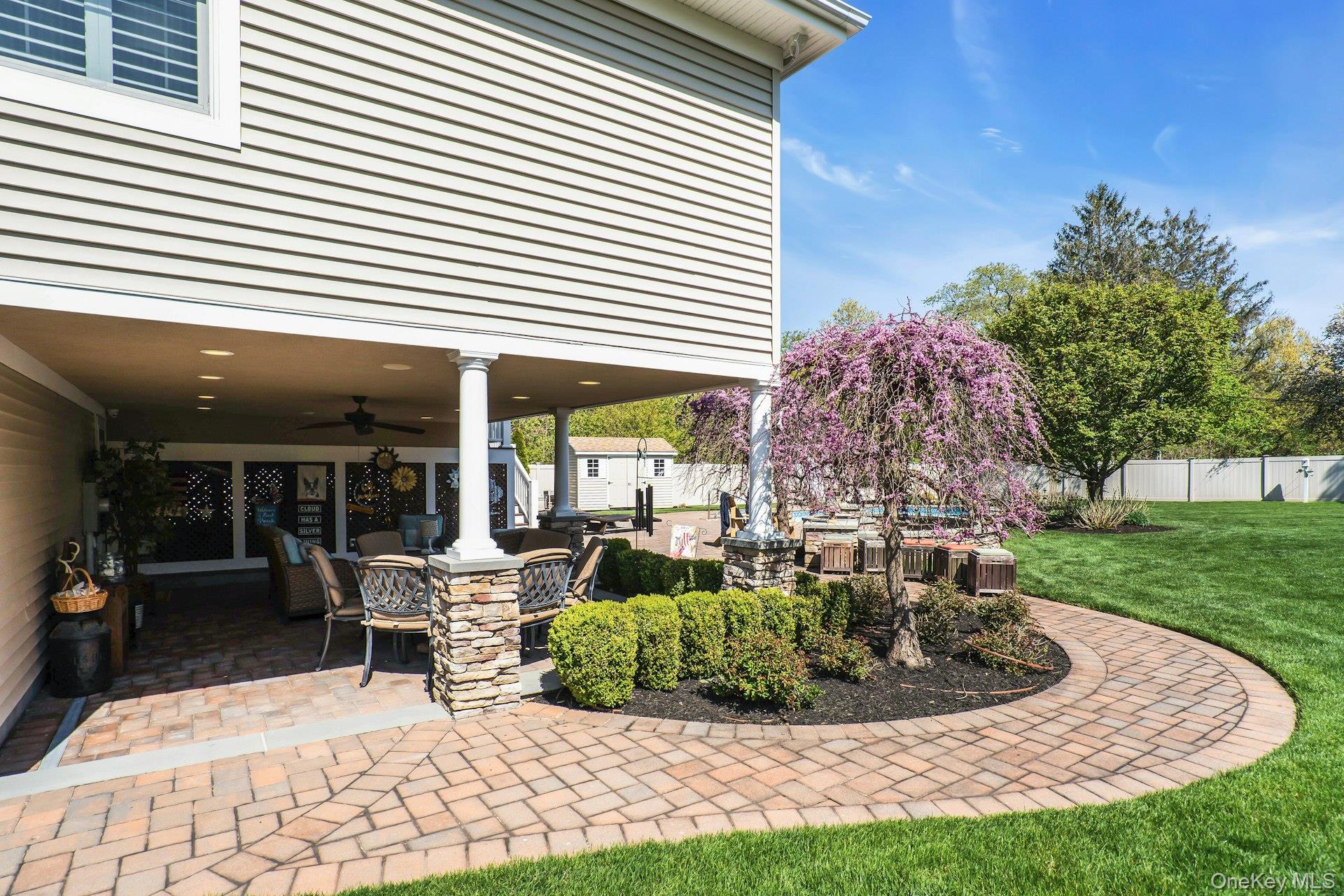 101 Hayrick Lane Commack, NY 11725 - Photo 43 of 50 a view of a house with backyard porch and sitting area