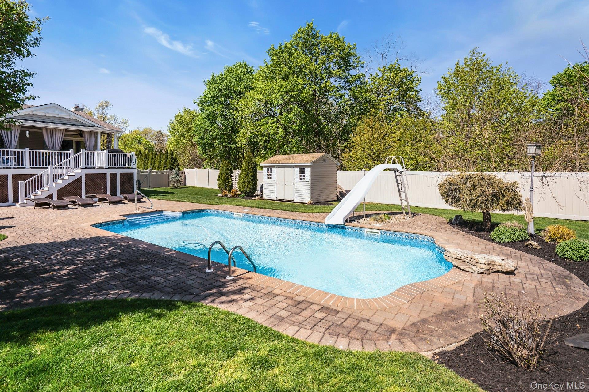 101 Hayrick Lane Commack, NY 11725 - Photo 46 of 50 a view of a house with swimming pool