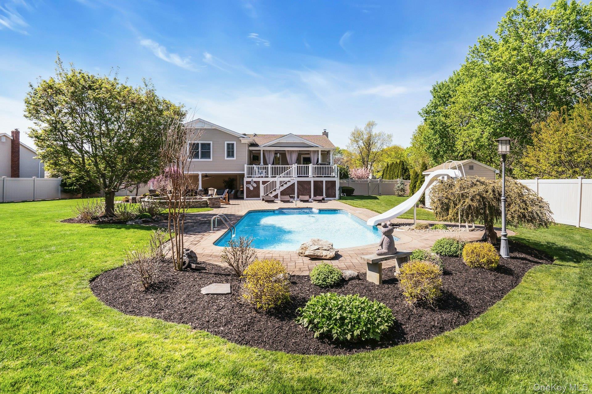 101 Hayrick Lane Commack, NY 11725 - Photo 47 of 50 a view of a house with a garden and trees