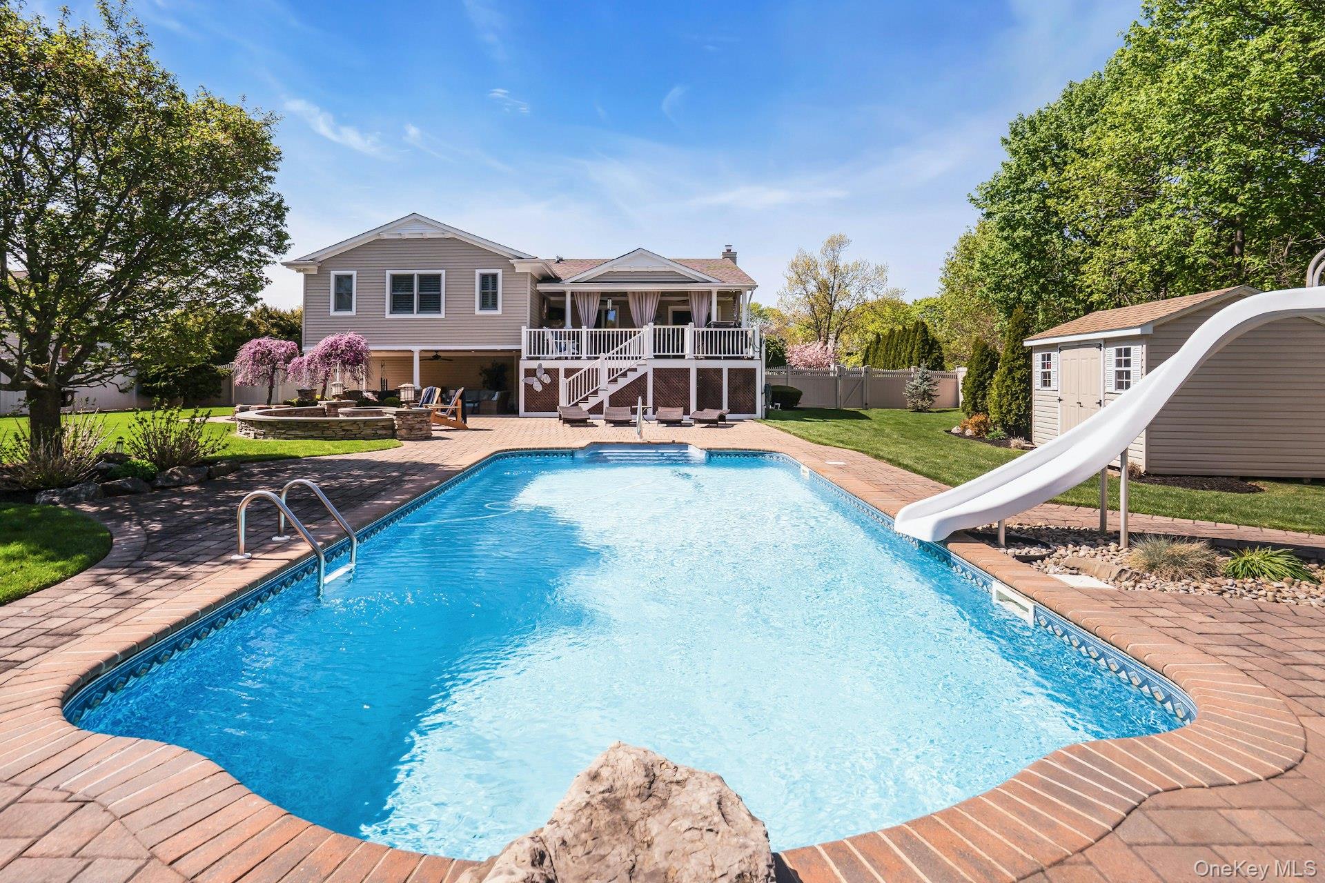 101 Hayrick Lane Commack, NY 11725 - Photo 48 of 50 a view of a house with swimming pool
