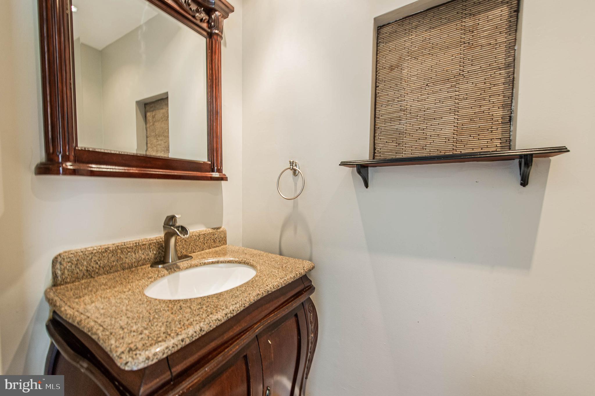 8708 Granite Lane Laurel, MD 20708 - Photo 5 of 52 Main level powder room