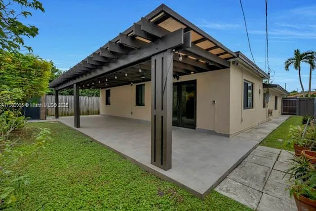 a view of a house with a small yard