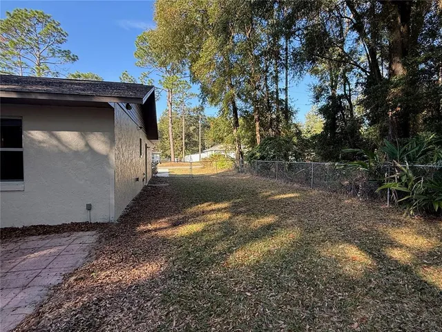 a view of a garage with a tree