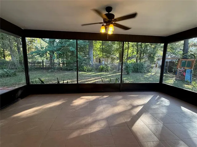 a view of an empty room with a large window