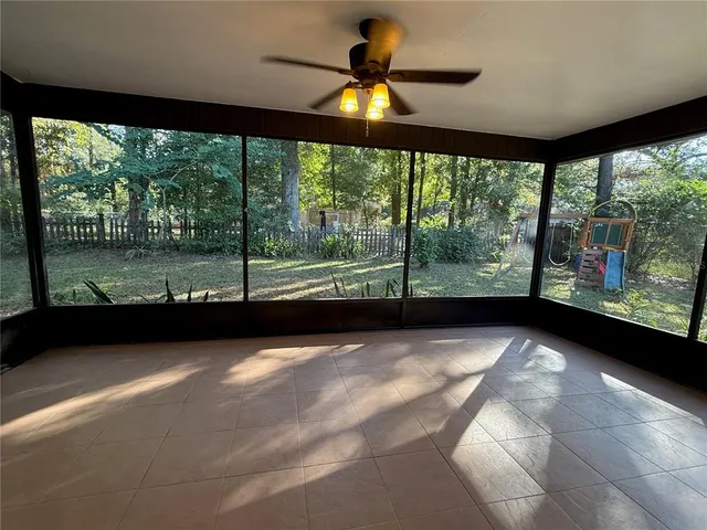 a view of an empty room with a large window