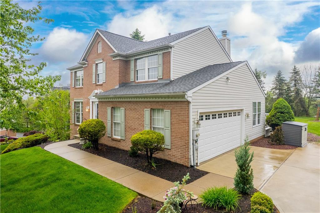 602 Birch Court Bridgeville, PA 15017 - Photo 4 of 47 a front view of a house with a garden