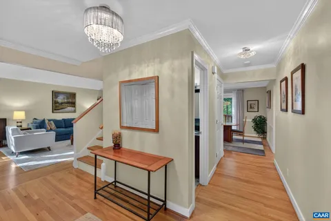 a view of a livingroom with furniture and chandelier