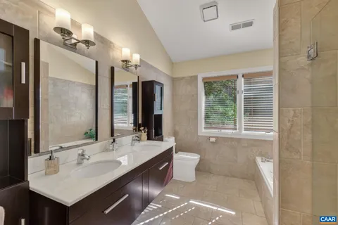 a white bath tub sitting next to a window