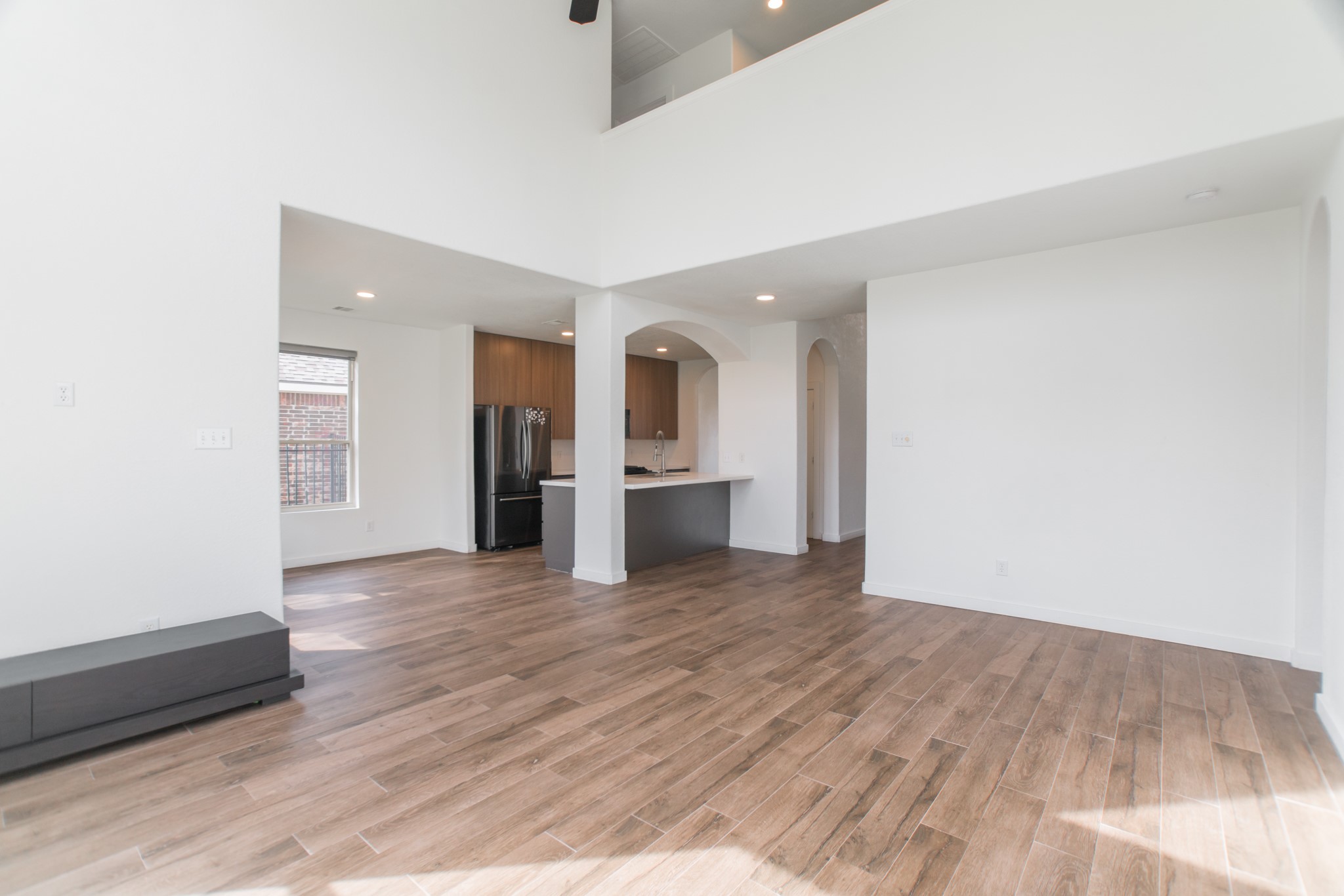 102 East Lasting Spring Circle Spring, TX 77389 - Photo 19 of 45 an empty room with wooden floor and a window