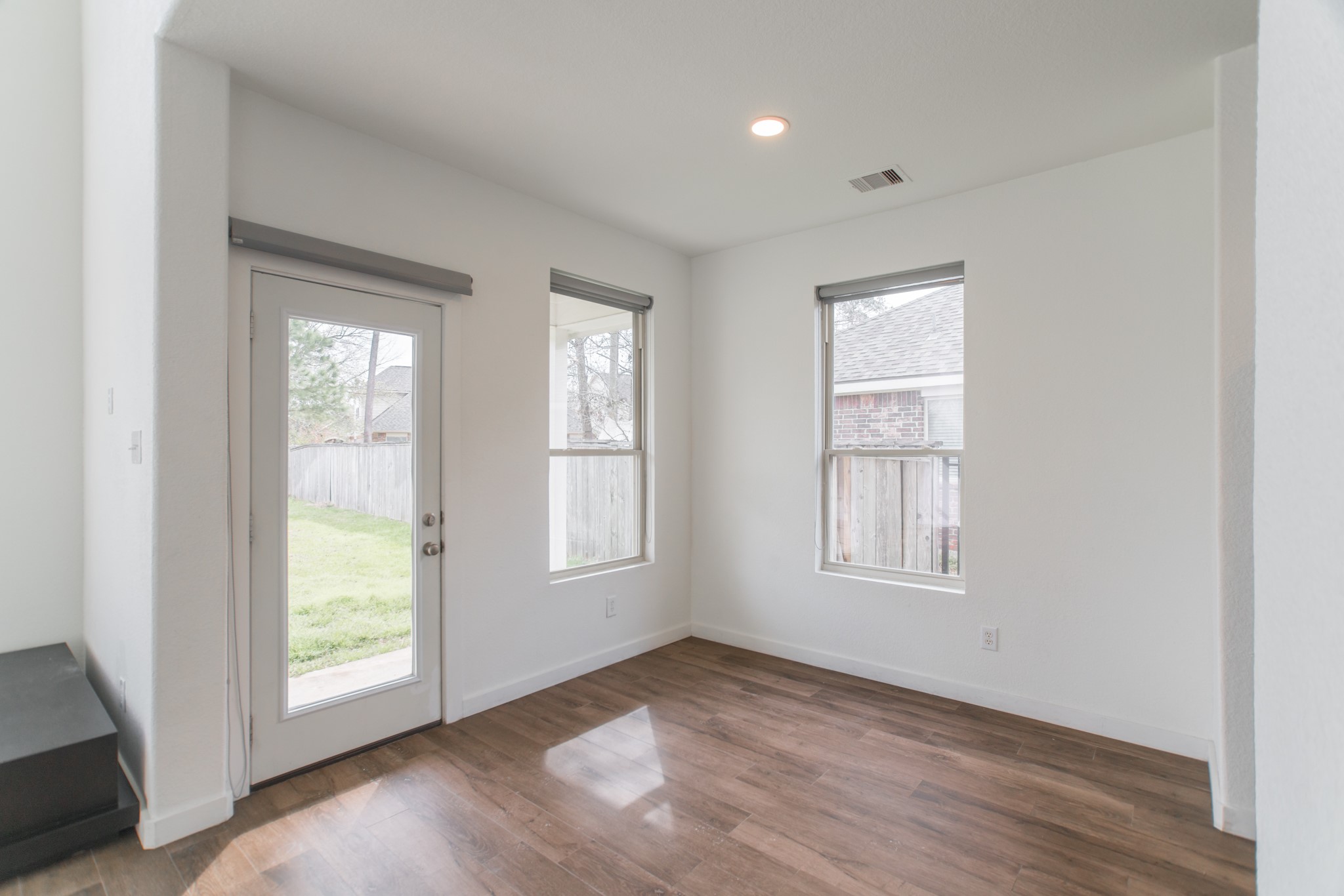 102 East Lasting Spring Circle Spring, TX 77389 - Photo 21 of 45 an empty room with wooden floor and windows