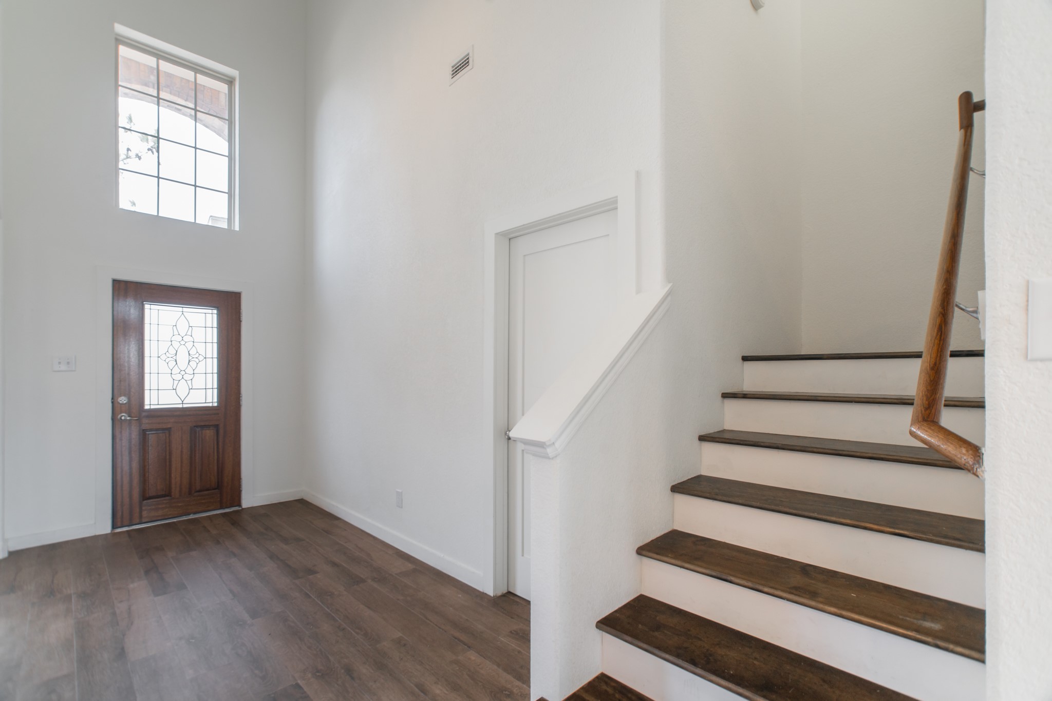 102 East Lasting Spring Circle Spring, TX 77389 - Photo 31 of 45 a view of entryway with wooden floor and stairs