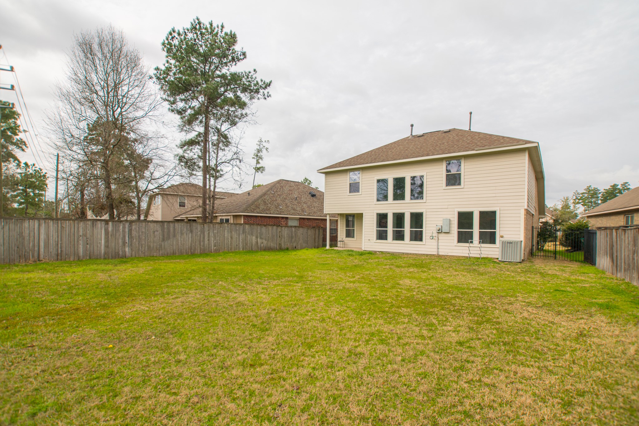 102 East Lasting Spring Circle Spring, TX 77389 - Photo 45 of 45 a view of a house with a yard and a large tree