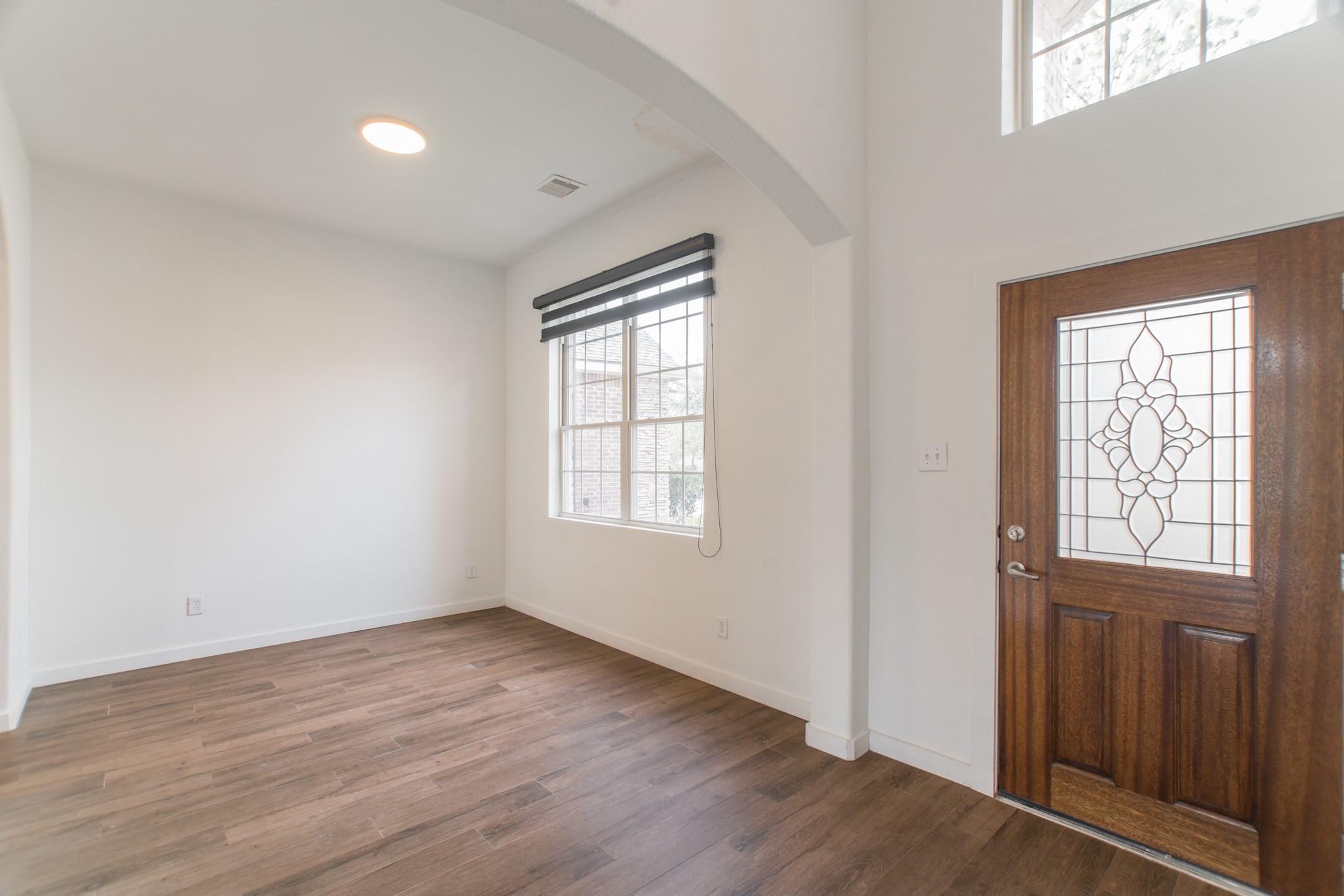 102 East Lasting Spring Circle Spring, TX 77389 - Photo 6 of 45 an empty room with wooden floor and windows