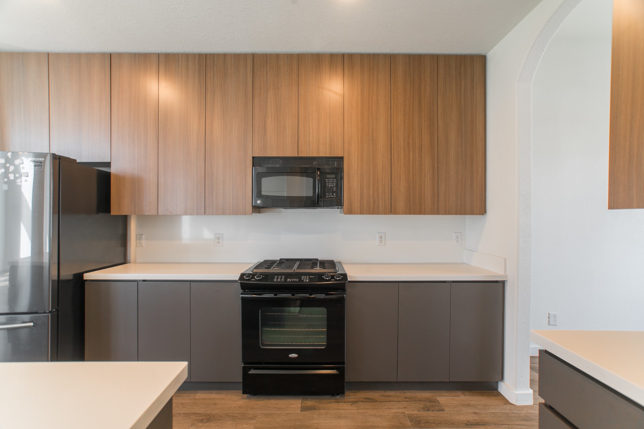 102 East Lasting Spring Circle Spring, TX 77389 - Photo 10 of 45 a kitchen with granite countertop a stove and a refrigerator