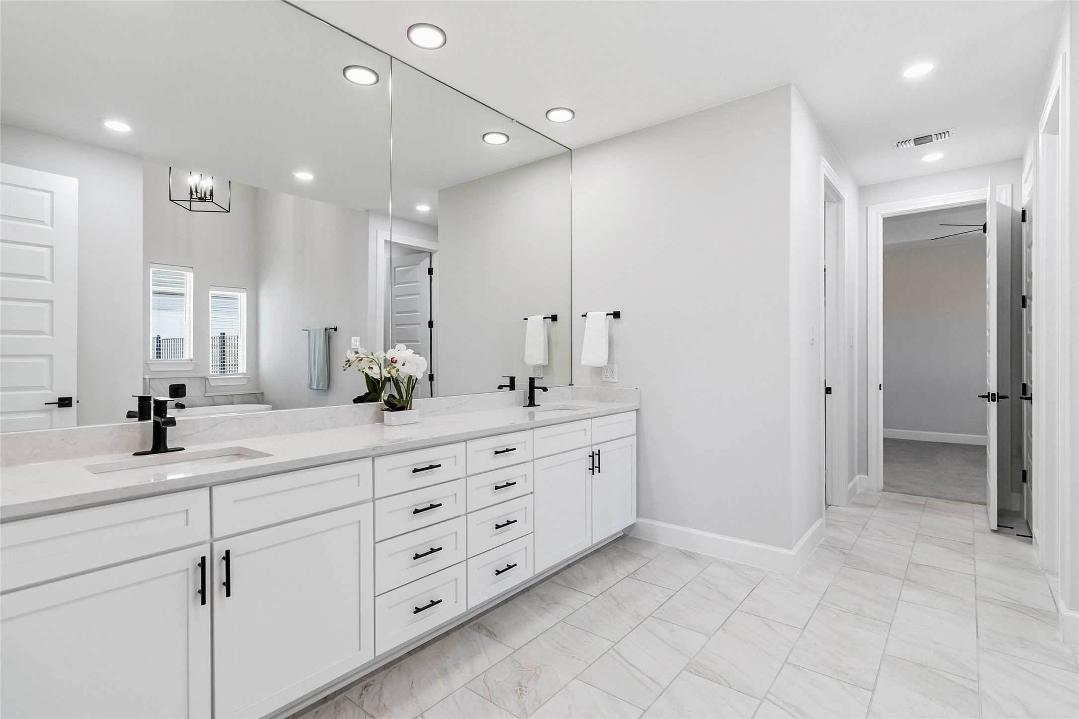 640 Prairie Clover Drive Dripping Springs, TX 78620 - Photo 15 of 32 Full bathroom with double vanity, recessed lighting, and light marble finish floors
