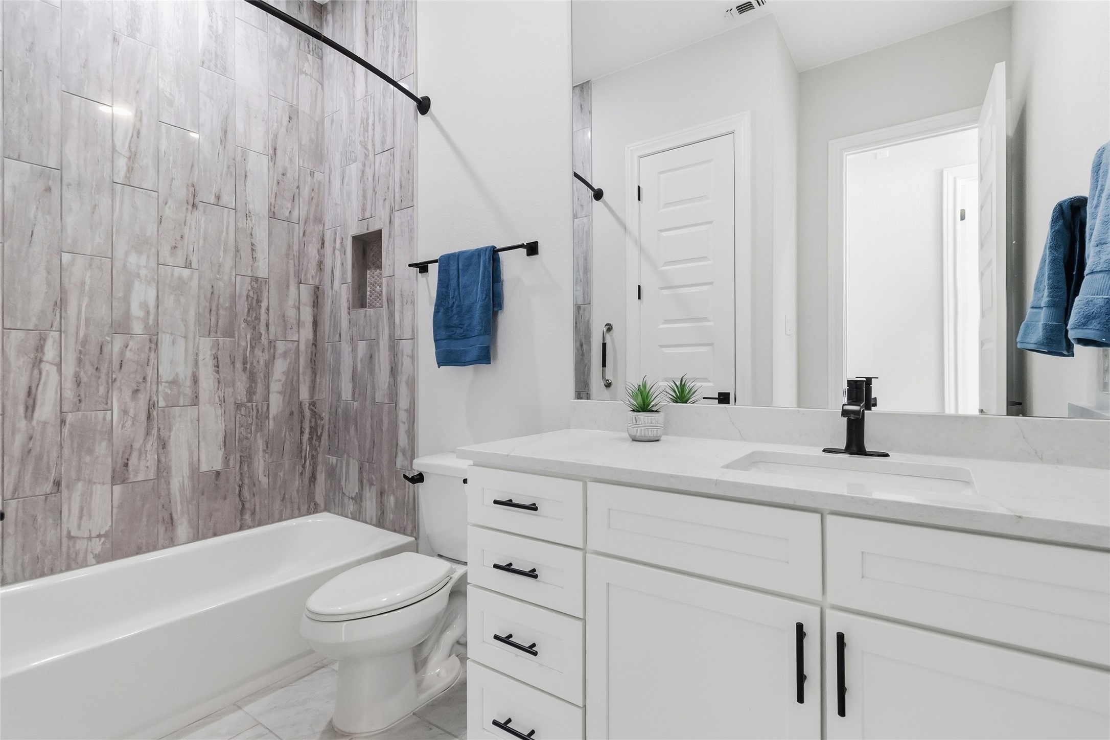640 Prairie Clover Drive Dripping Springs, TX 78620 - Photo 21 of 32 Bathroom featuring shower combination and vanity