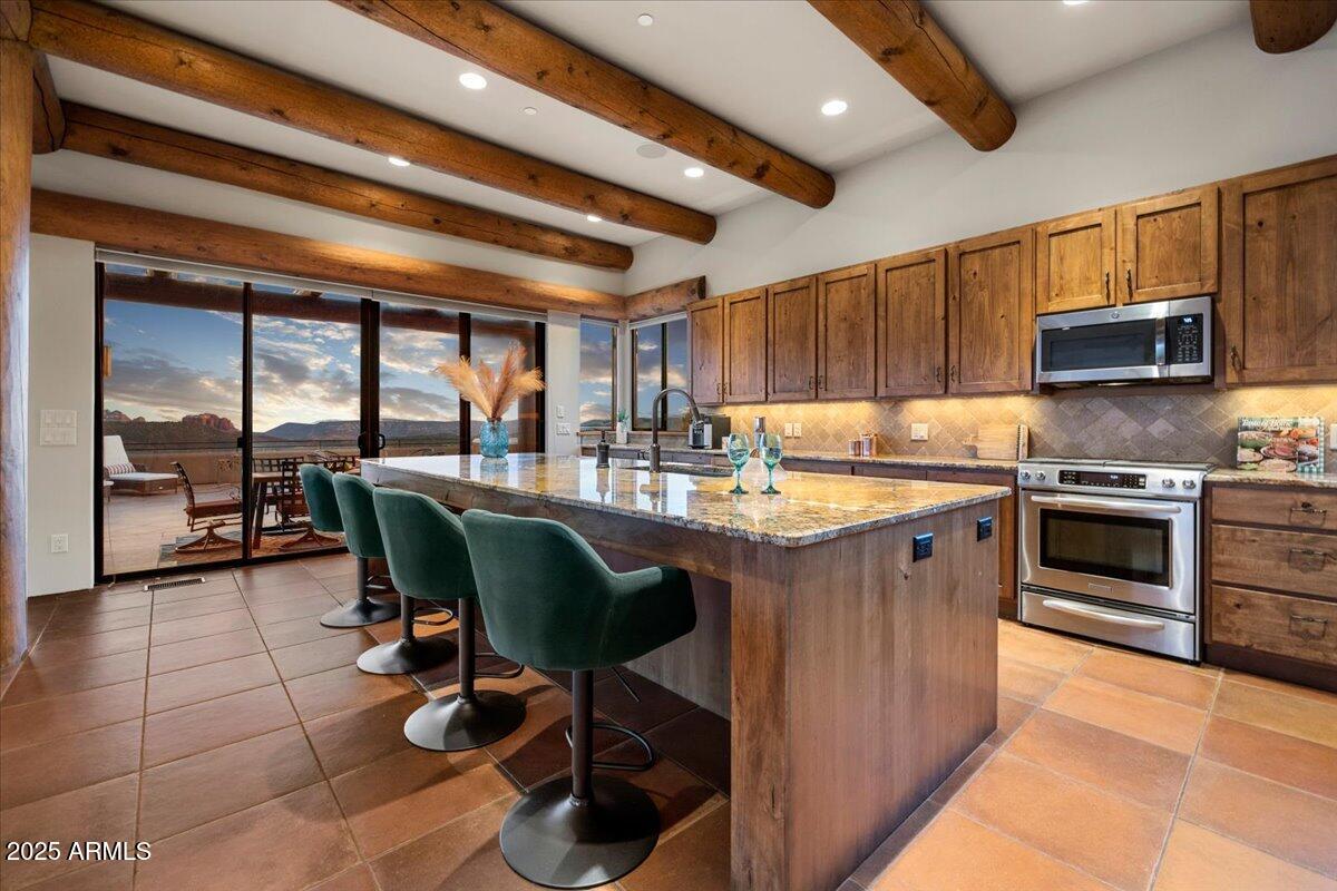 730-750 Rhapsody Road Sedona, AZ 86336 - Photo 26 of 63 026-Kitchen to Entertaining Patio
