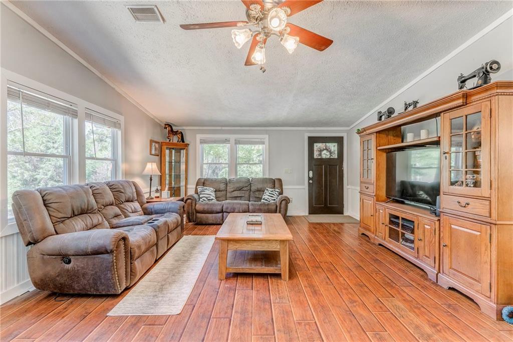 1039 Old Cedartown Road Rockmart, GA 30153 - Photo 12 of 40 a living room with furniture and a flat screen tv