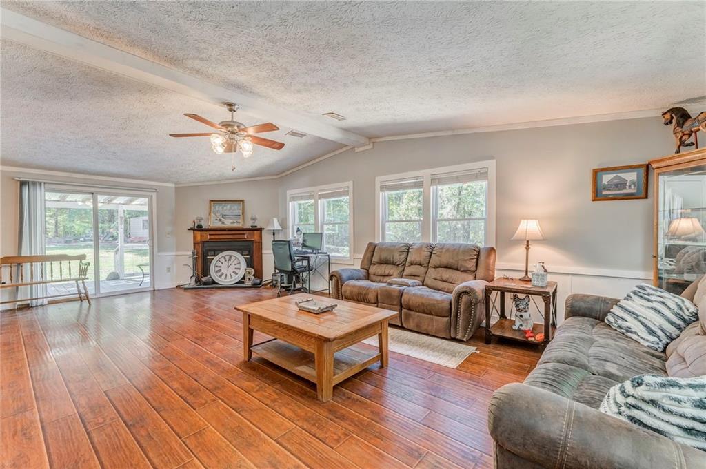 1039 Old Cedartown Road Rockmart, GA 30153 - Photo 13 of 40 a living room with furniture and a fireplace