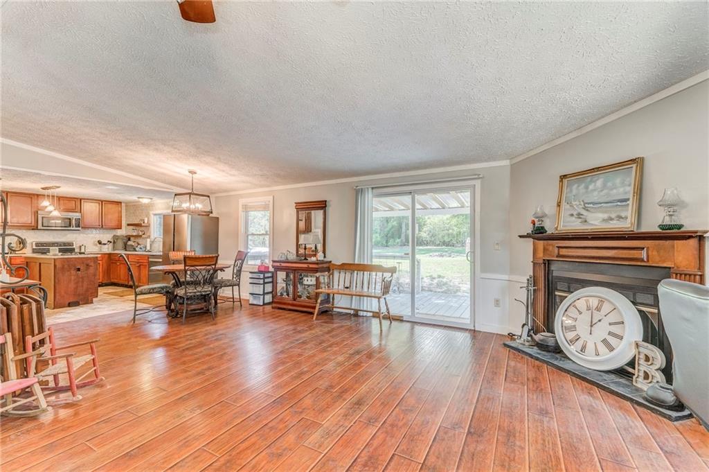 1039 Old Cedartown Road Rockmart, GA 30153 - Photo 14 of 40 a living room with furniture and a wooden floor