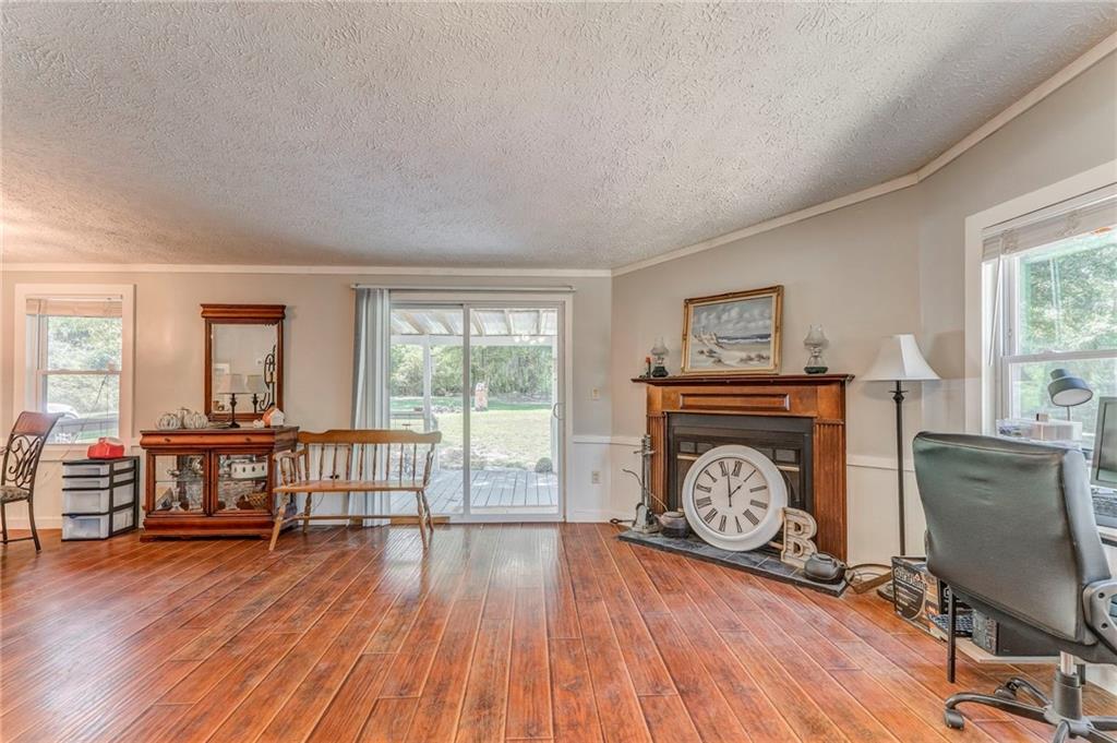 1039 Old Cedartown Road Rockmart, GA 30153 - Photo 15 of 40 a view of a livingroom with furniture wooden floor and a window