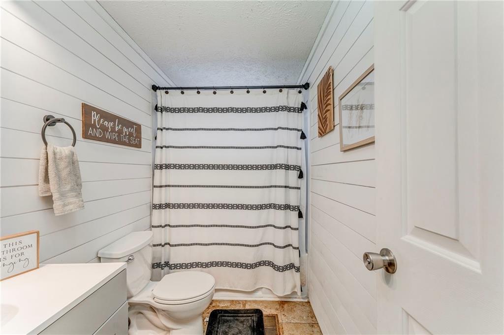 1039 Old Cedartown Road Rockmart, GA 30153 - Photo 33 of 40 a bathroom with a toilet and a shower