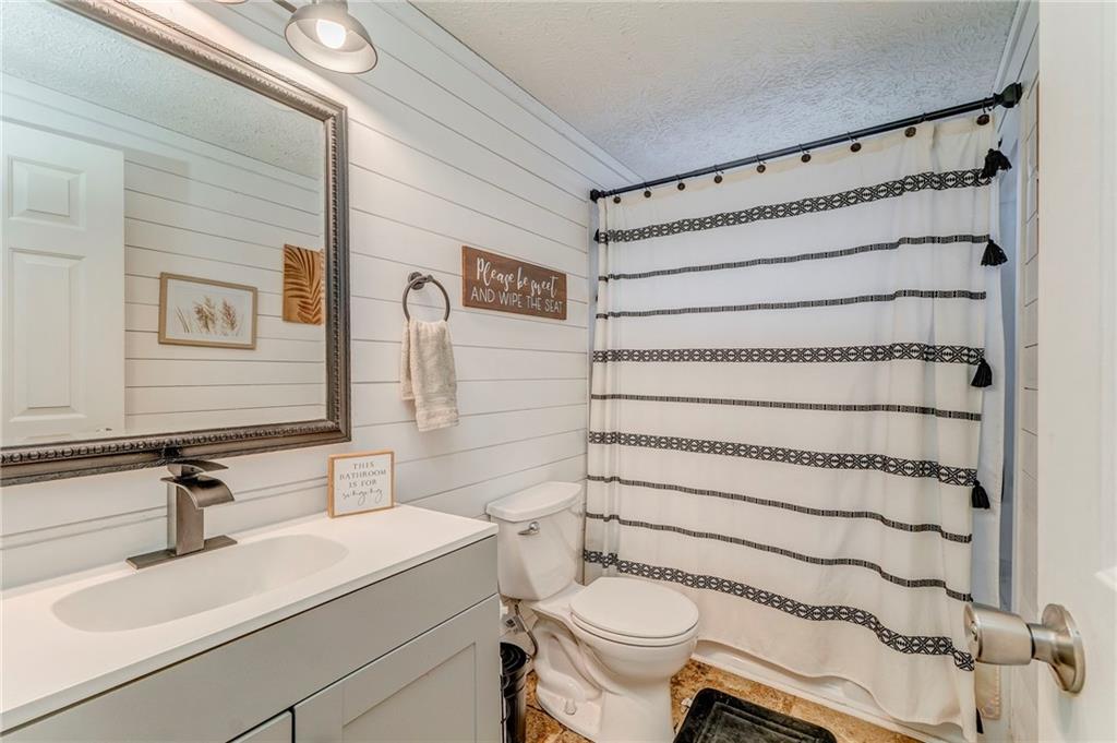 1039 Old Cedartown Road Rockmart, GA 30153 - Photo 34 of 40 a bathroom with a sink toilet and shower