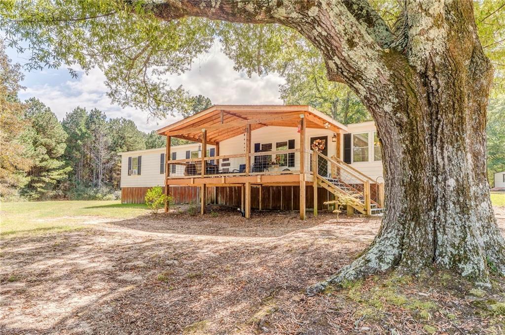 1039 Old Cedartown Road Rockmart, GA 30153 - Photo 4 of 40 a view of a house with a yard and sitting area
