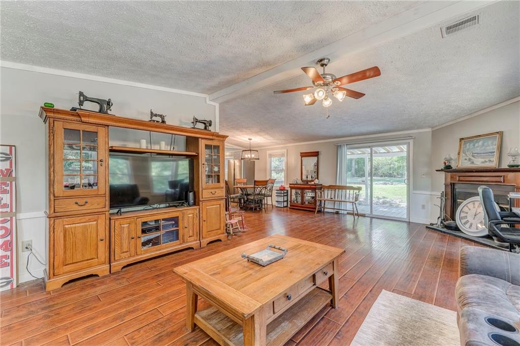 1039 Old Cedartown Road Rockmart, GA 30153 - Photo 10 of 40 a living room with furniture and a flat screen tv