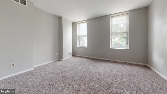 an empty room with windows