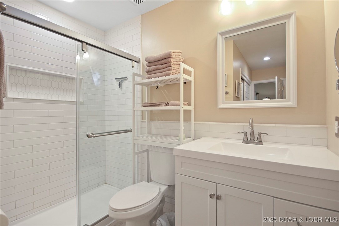 2441 Mohawk Lane Osage Beach, MO 65065 - Photo 20 of 30 Primary Ensuite Bathroom with Walk in Tile Shower