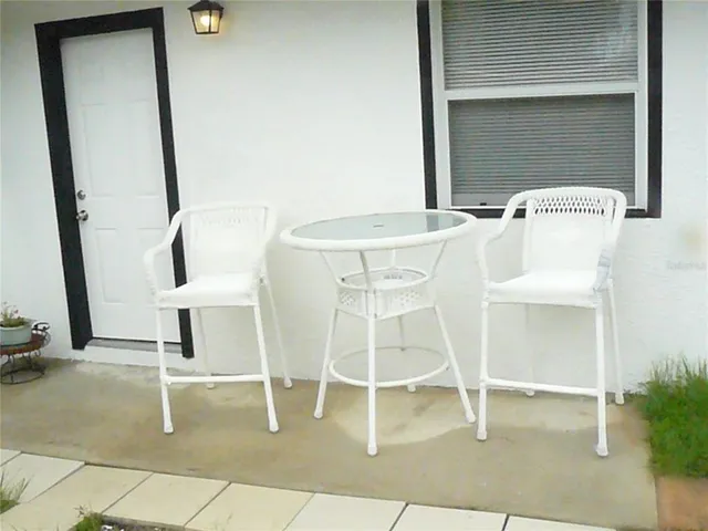 a dining room with table and chairs