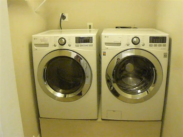 a utility room with dryer and washer