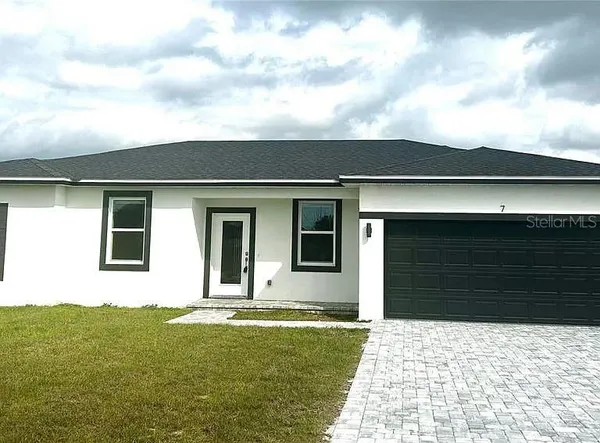a house view with a backyard space