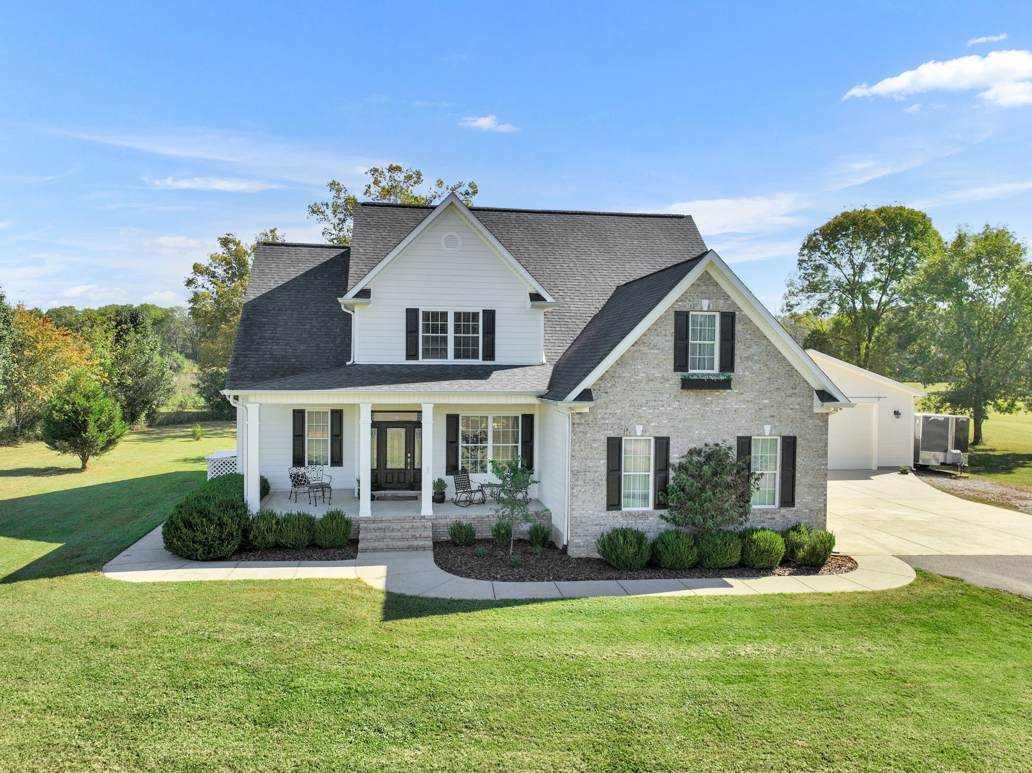 front view of a house with a yard