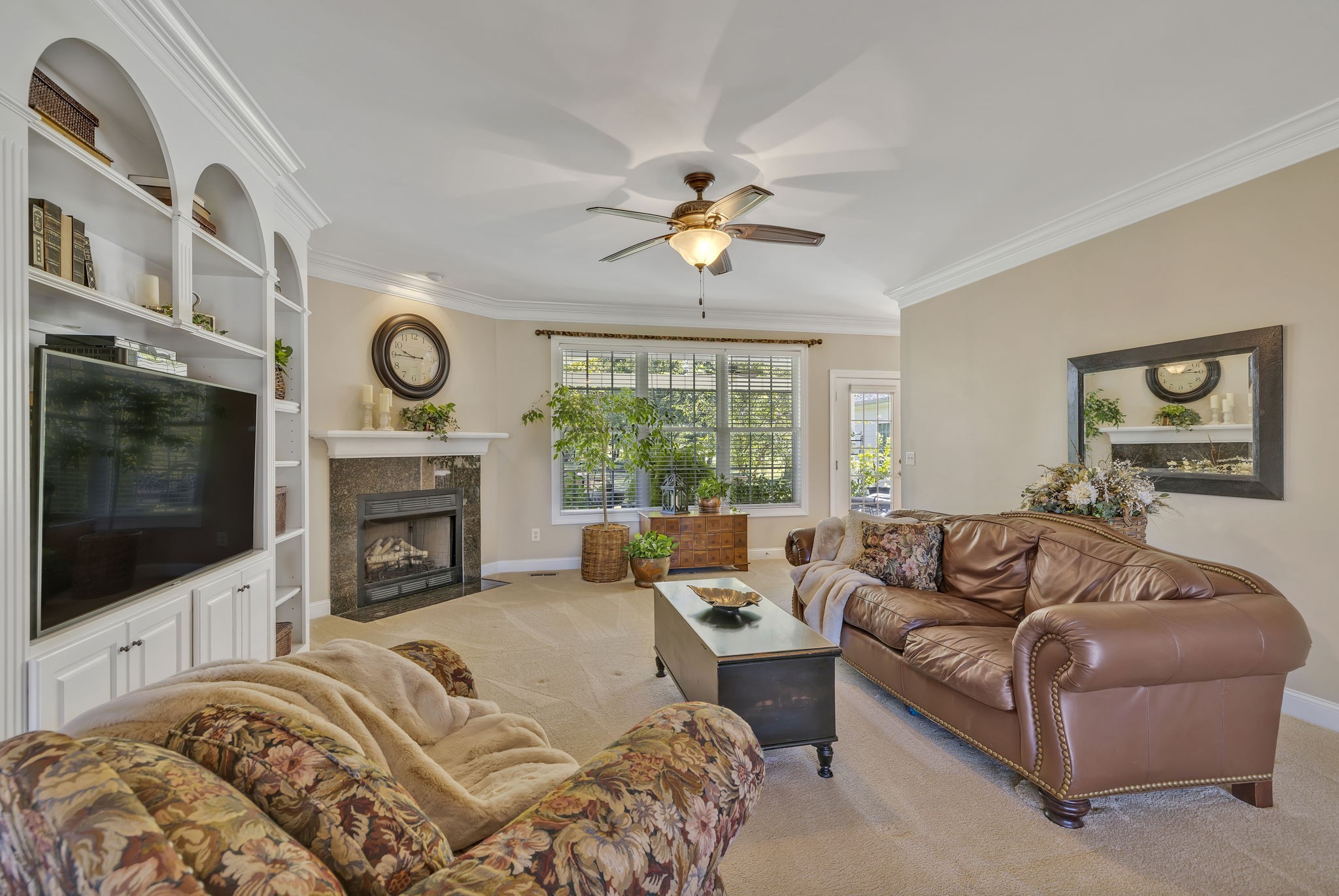 3917 Buck Matthews Road Columbia, TN 38401 - Photo 12 of 60 a living room with furniture a fireplace and a flat screen tv