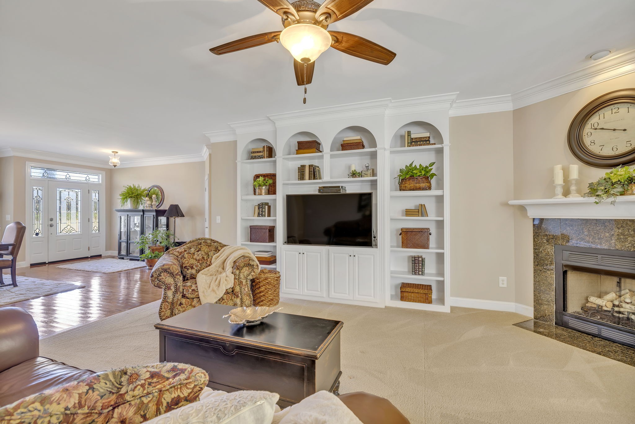 3917 Buck Matthews Road Columbia, TN 38401 - Photo 14 of 60 a living room with furniture a flat screen tv and a fireplace