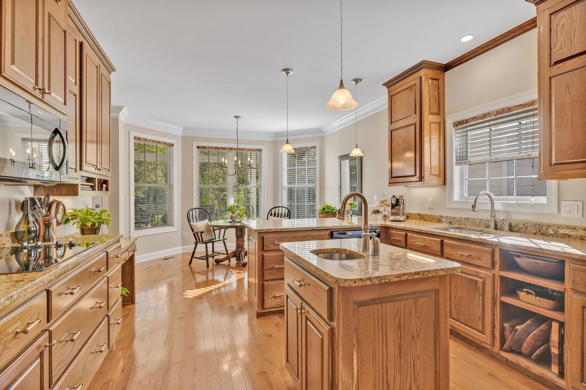 3917 Buck Matthews Road Columbia, TN 38401 - Photo 16 of 60 a kitchen with a sink stove and wooden cabinets