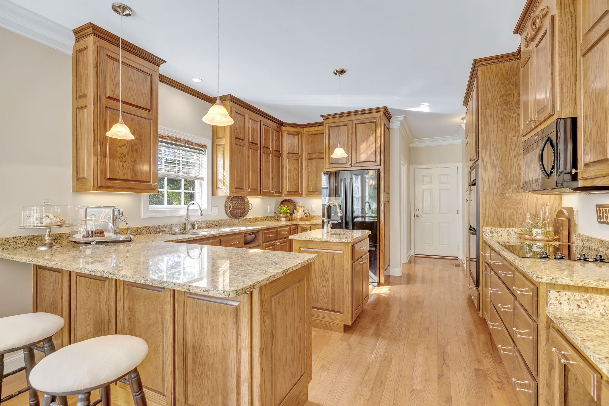 3917 Buck Matthews Road Columbia, TN 38401 - Photo 19 of 60 a kitchen with a sink cabinets and wooden floor