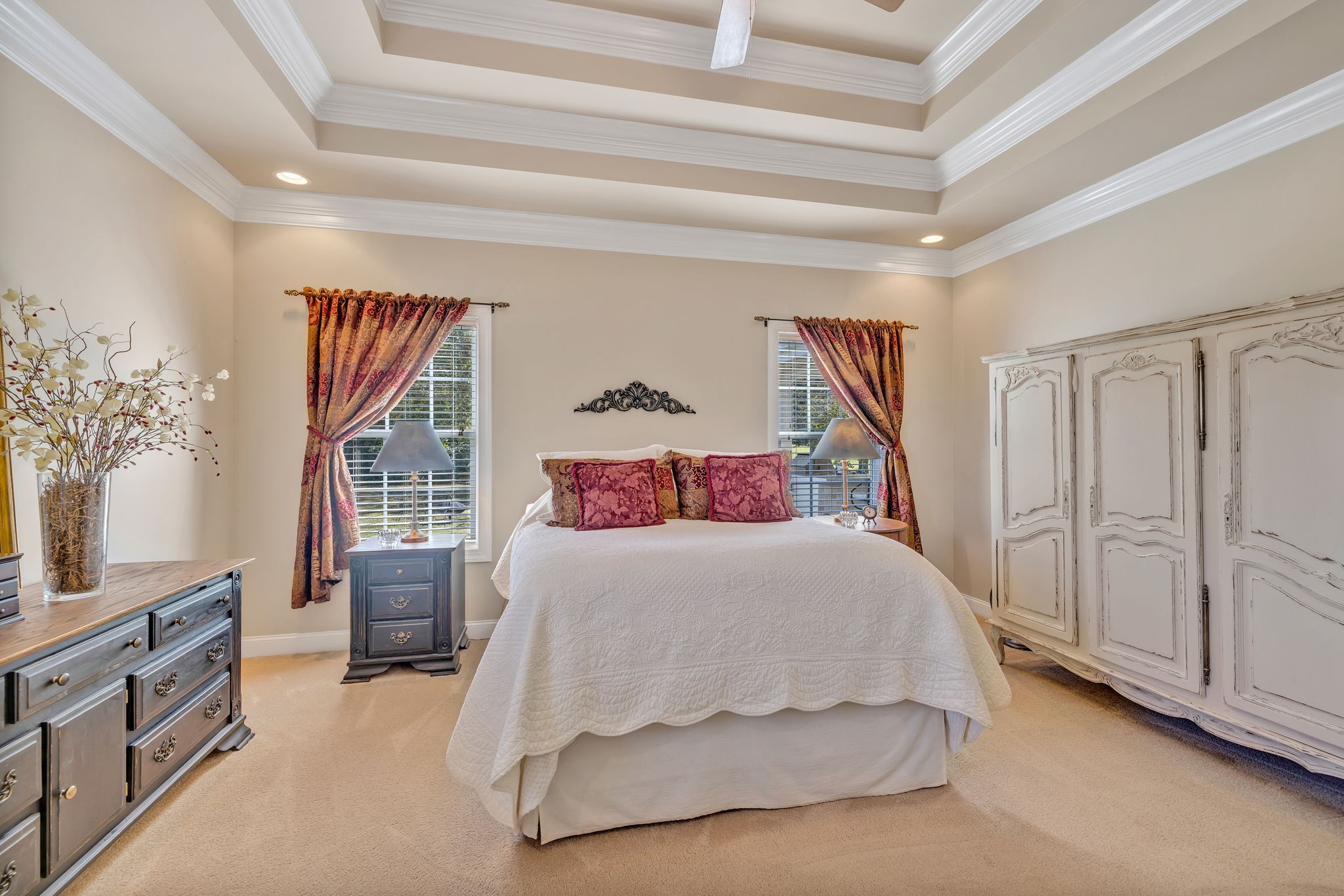 3917 Buck Matthews Road Columbia, TN 38401 - Photo 26 of 60 a bedroom with a large bed and a chandelier