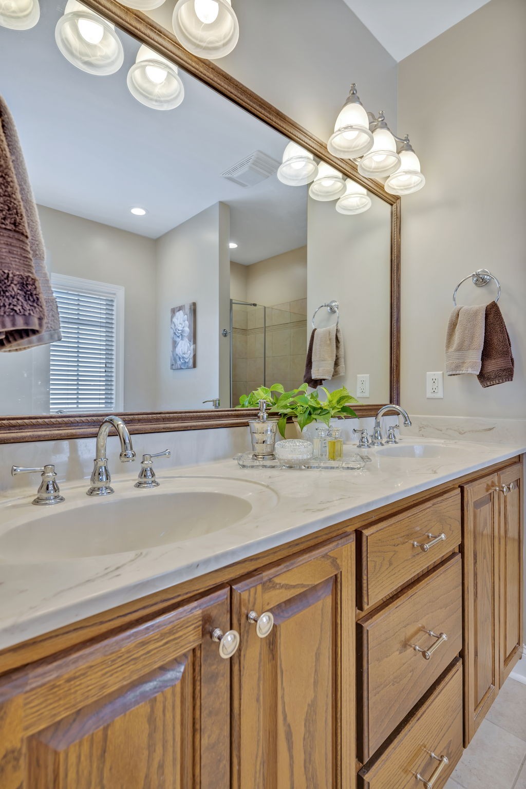 3917 Buck Matthews Road Columbia, TN 38401 - Photo 29 of 60 a bathroom with a granite countertop sink a large mirror and vanity