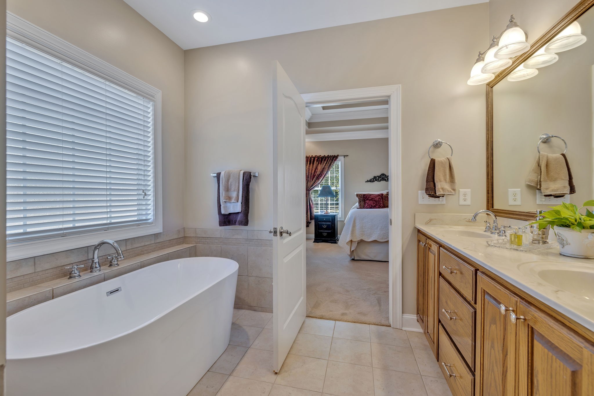3917 Buck Matthews Road Columbia, TN 38401 - Photo 30 of 60 a spacious bathroom with a tub sink and mirror