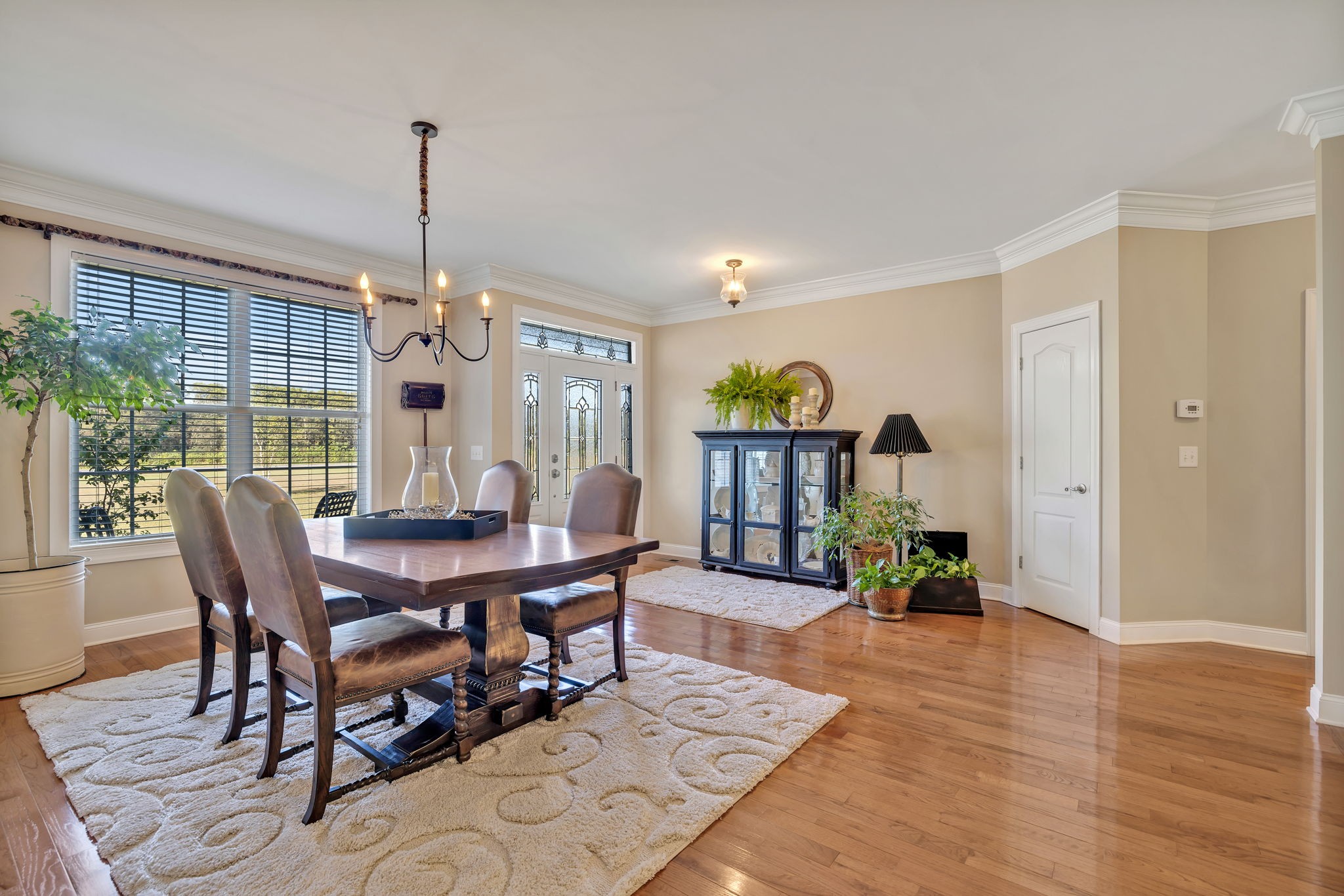 3917 Buck Matthews Road Columbia, TN 38401 - Photo 9 of 60 a view of a dining room and livingroom with furniture wooden floor a chandelier