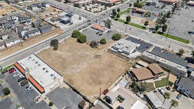 an aerial view of a large building with yard