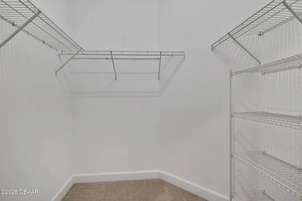 a view of a room with racks on the wall